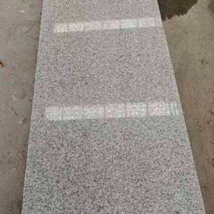 曲靖芝麻白光面毛板